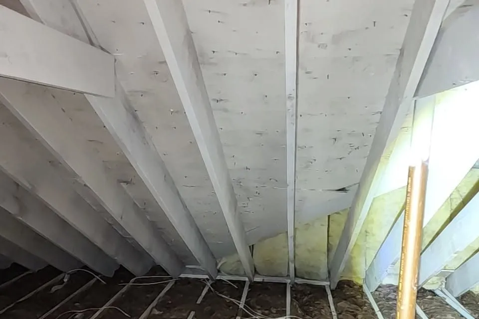 Attic roof sheathing and rafters after mold remediation